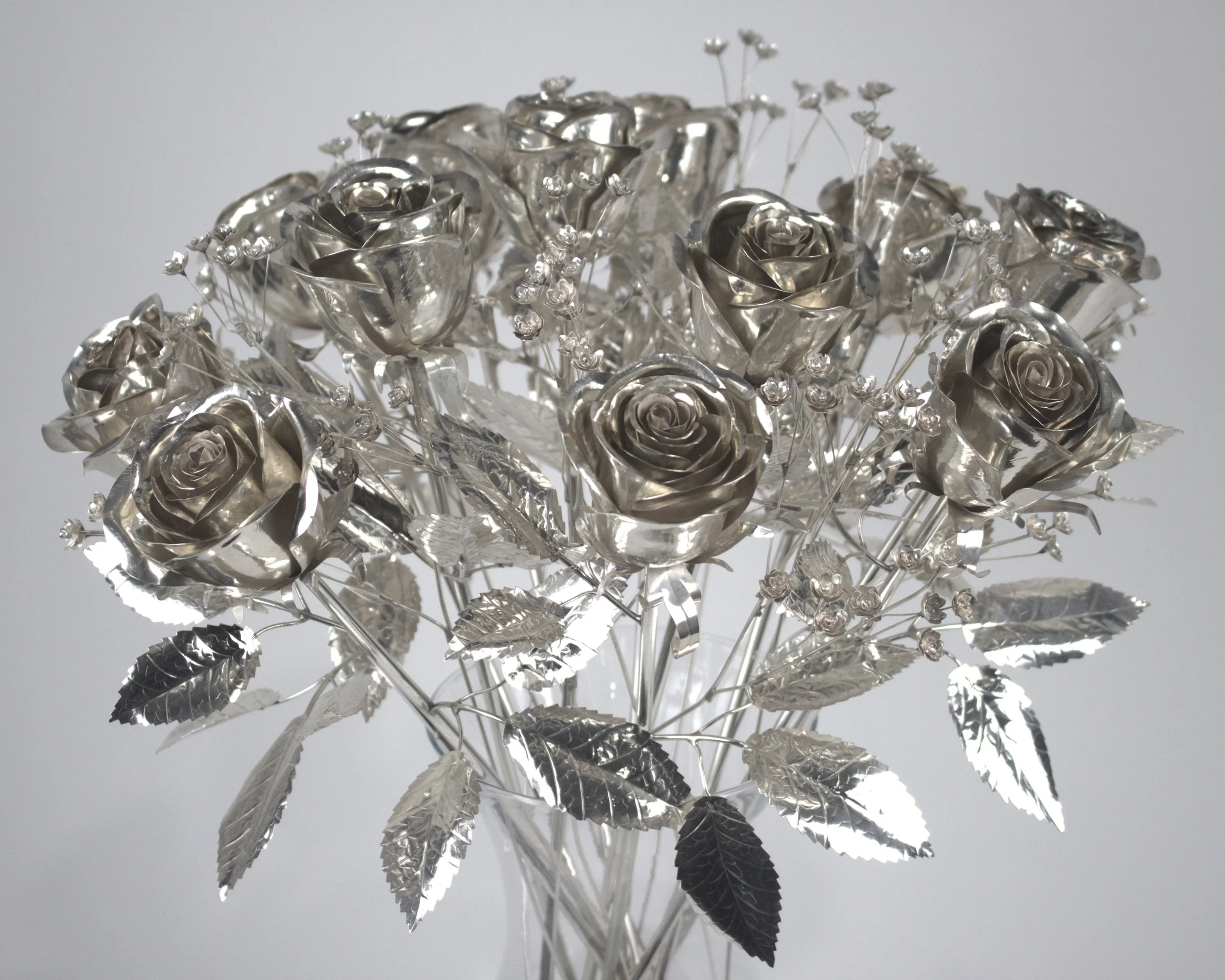 One dozen sterling silver roses with baby's breath (.925 sterling